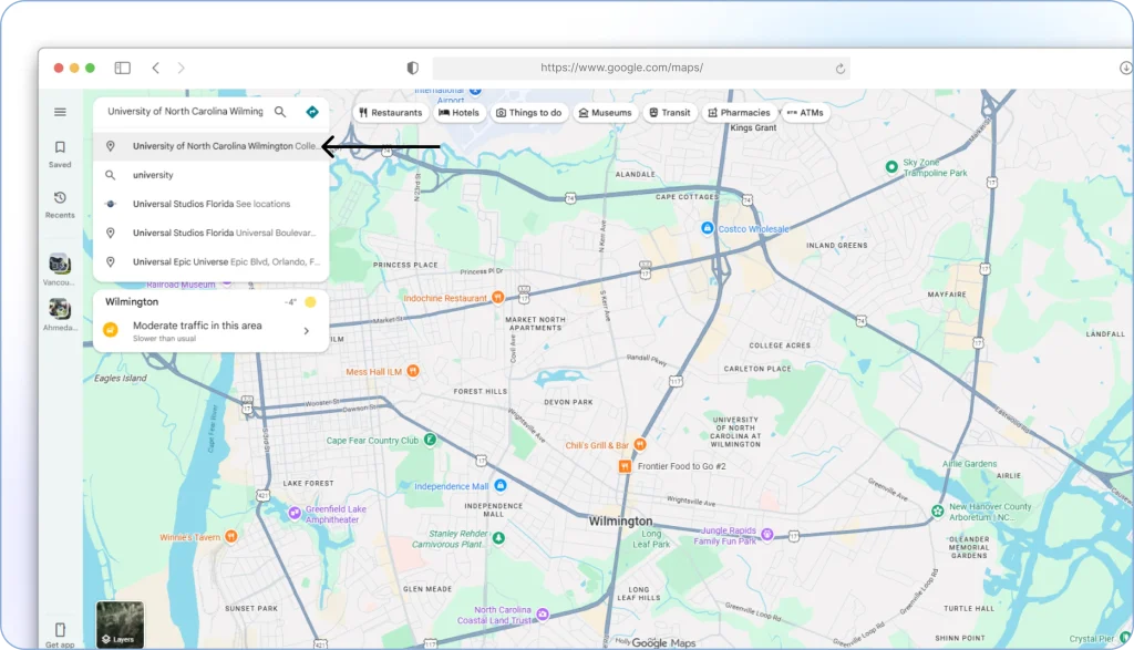 Entering a destination in the Google Maps search bar and selecting it from the dropdown results